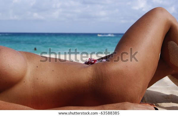 woman tanning nude